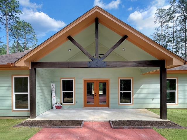 rear view of property with french doors and a patio