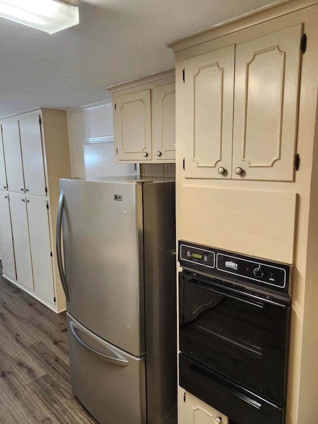 911 Allendale, Lufkin, TX 75904 - kitchen with freestanding refrigerator, black oven, dark wood finished floors, and a warming drawer