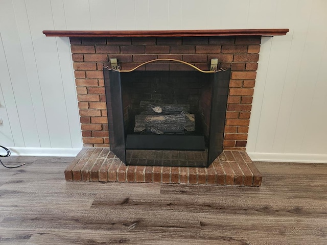 911 Allendale, Lufkin, TX 75904 - detailed view of wood finished floors and a brick fireplace