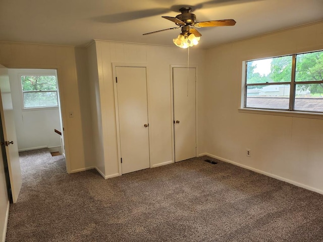 911 Allendale, Lufkin, TX 75904 - unfurnished bedroom with carpet, ornamental molding, and ceiling fan