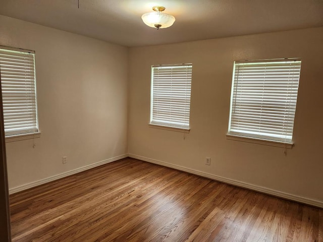 911 Allendale, Lufkin, TX 75904 - empty room featuring wood finished floors and healthy amount of natural light