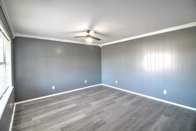 811 Overstreet Cir, Crockett, TX 75835 - empty room with ceiling fan, wood finished floors, crown molding, and baseboards