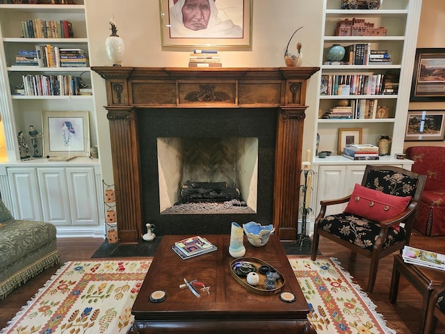 102 Harmony Hill Ct, Lufkin, TX 75901 - living area with wood finished floors, a fireplace with flush hearth, and built in features