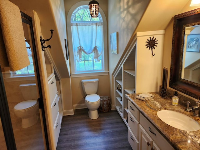 102 Harmony Hill Ct, Lufkin, TX 75901 - bathroom with toilet, wood finished floors, vanity, and baseboards