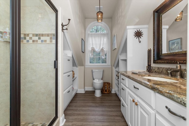 102 Harmony Hill Ct, Lufkin, TX 75901 - full bath with toilet, a shower stall, wood finished floors, vanity, and baseboards