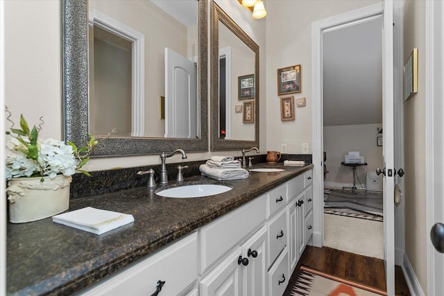 102 Harmony Hill Ct, Lufkin, TX 75901 - bathroom featuring double vanity and wood finished floors
