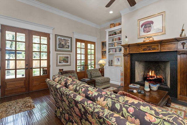 102 Harmony Hill Ct, Lufkin, TX 75901 - living room with french doors, built in features, a fireplace with flush hearth, crown molding, and a ceiling fan