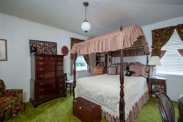 carpeted bedroom with ornamental molding