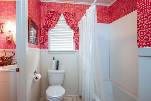 full bathroom with shower / bath combo, toilet, and sink