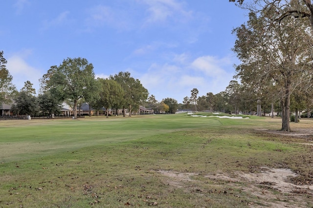 view of property's community featuring a yard