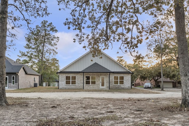 back of property with central AC