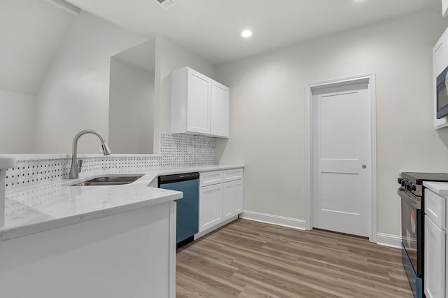 kitchen featuring dishwasher, sink, light hardwood / wood-style flooring, electric range, and white cabinetry