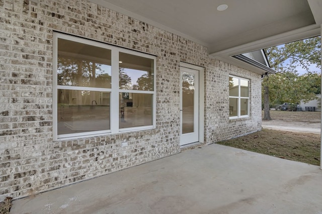 doorway to property featuring a patio area