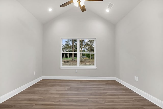 spare room with high vaulted ceiling, ceiling fan, and dark wood-type flooring