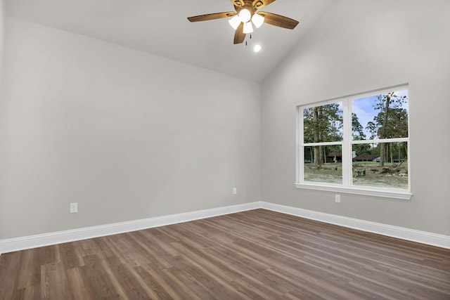 empty room featuring dark hardwood / wood-style flooring, high vaulted ceiling, and ceiling fan