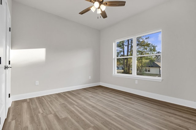 empty room featuring ceiling fan and light wood-type flooring