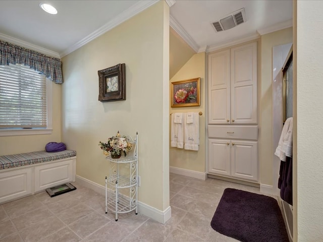 bathroom featuring tile patterned flooring and ornamental molding