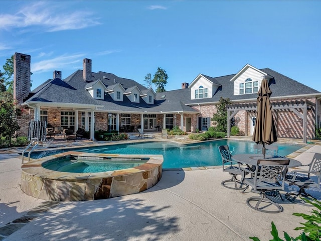 view of swimming pool with a pergola, an in ground hot tub, and a patio