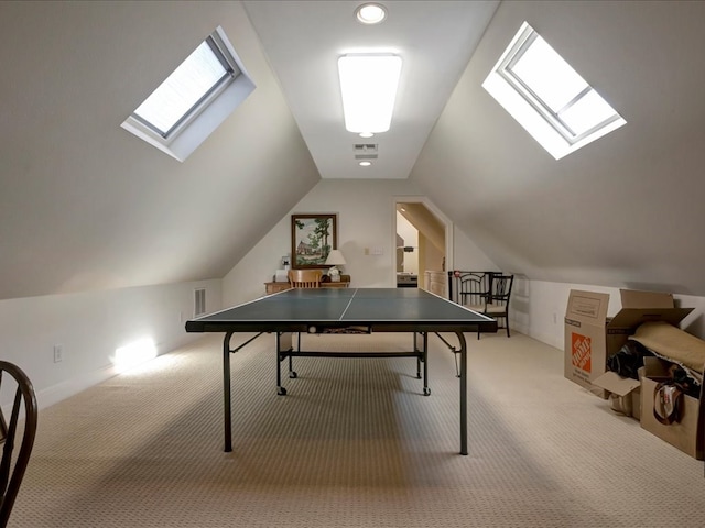 game room featuring carpet flooring and lofted ceiling with skylight