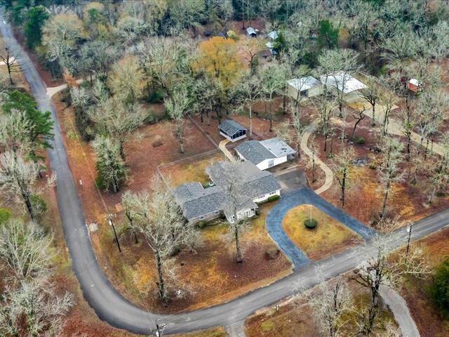 ranch-style house featuring a garage and a front lawn