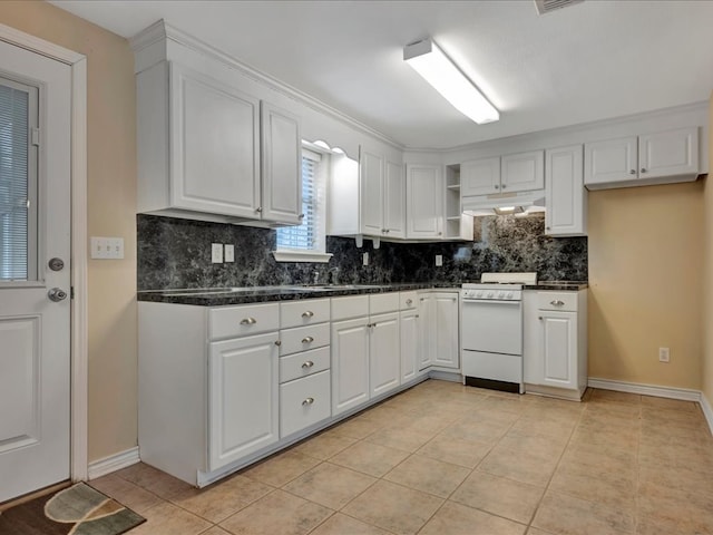 kitchen featuring white cabinets, decorative backsplash, light tile patterned floors, and white range with gas stovetop