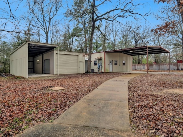 exterior space with a carport and a garage