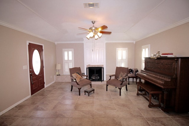 sitting room with ornamental molding, ceiling fan, and lofted ceiling