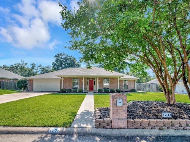 ranch-style house with a front yard and a garage