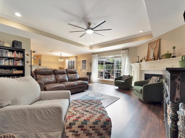 living room with ceiling fan and dark hardwood / wood-style floors