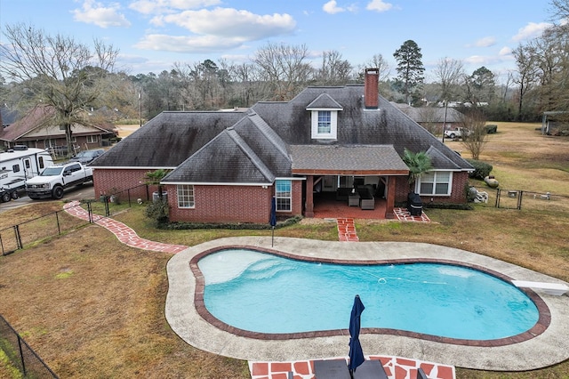 view of pool featuring a patio and a lawn