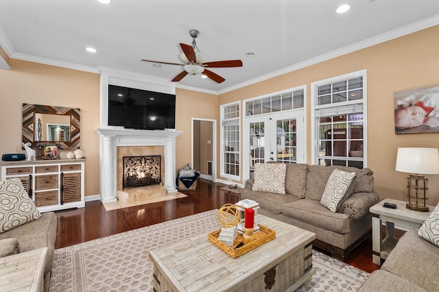 living room featuring crown molding, wood-type flooring, french doors, and ceiling fan