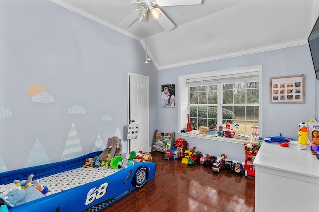 rec room with lofted ceiling, ornamental molding, dark hardwood / wood-style floors, and ceiling fan