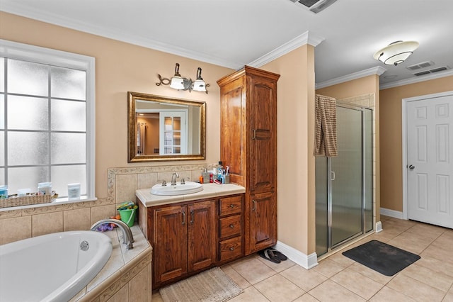 bathroom featuring tile patterned flooring, vanity, crown molding, and plus walk in shower