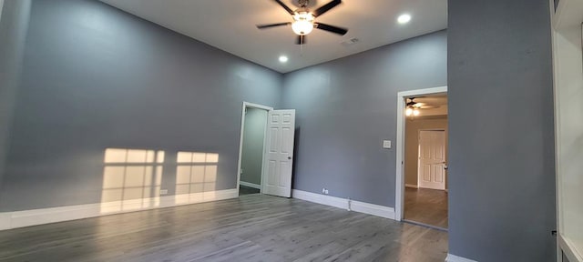 110 Hines St, Diboll, TX 75941 - empty room featuring ceiling fan, wood finished floors, a high ceiling, and recessed lighting