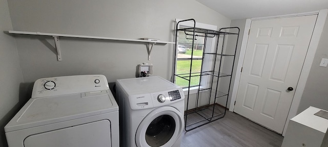 110 Hines St, Diboll, TX 75941 - laundry area with washer and dryer and light wood-style flooring