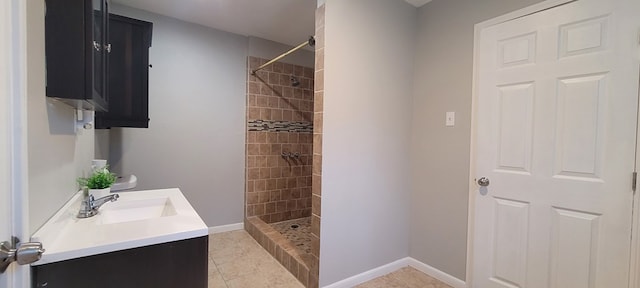 110 Hines St, Diboll, TX 75941 - bathroom with vanity, a tile shower, and tile patterned flooring