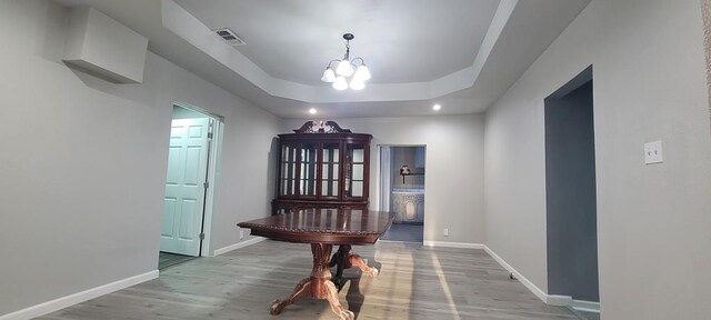 110 Hines St, Diboll, TX 75941 - hallway featuring a chandelier, wood finished floors, a raised ceiling, and recessed lighting