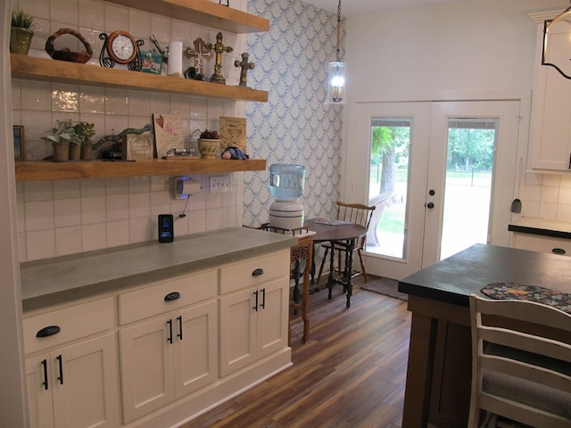 1208 Leslie Ln, Lufkin, TX 75901 - kitchen featuring dark countertops, open shelves, decorative backsplash, white cabinets, and french doors