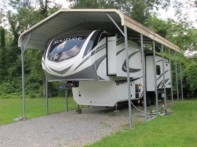 1208 Leslie Ln, Lufkin, TX 75901 - view of parking with a carport and view of scattered trees