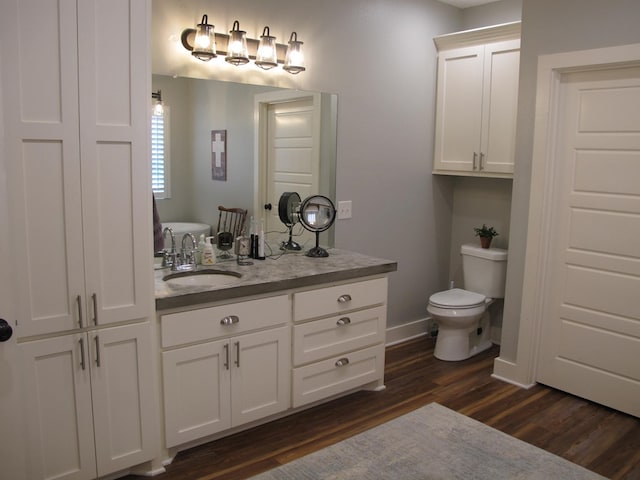 1208 Leslie Ln, Lufkin, TX 75901 - bathroom featuring wood finished floors and vanity