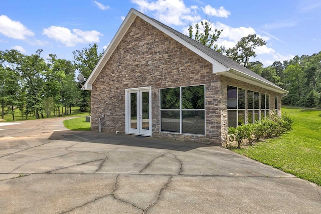 back of property featuring french doors