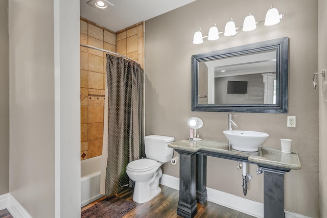 full bathroom with toilet, sink, shower / bath combo, and hardwood / wood-style flooring