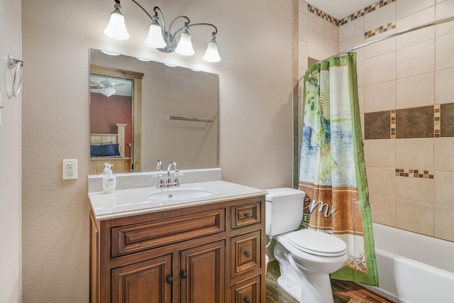 full bathroom featuring ceiling fan, shower / bath combination with curtain, wood-type flooring, toilet, and vanity