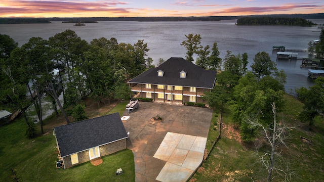 aerial view at dusk with a water view