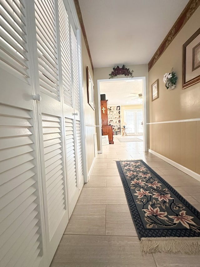 hall featuring wainscoting