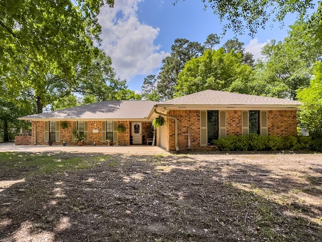 single story home with brick siding