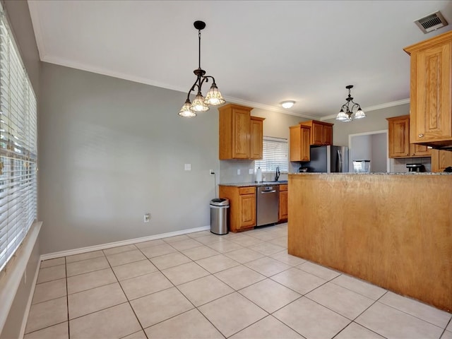 kitchen featuring crown molding, light tile patterned flooring, a notable chandelier, and appliances with stainless steel finishes