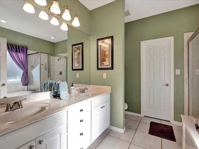 full bathroom with tile patterned flooring, vanity, independent shower and bath, and toilet