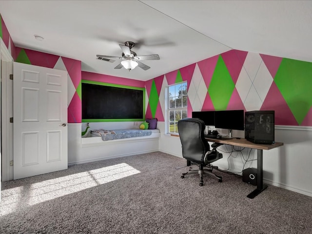 carpeted home office featuring ceiling fan