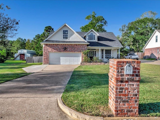 view of front facade with a garage and a front yard